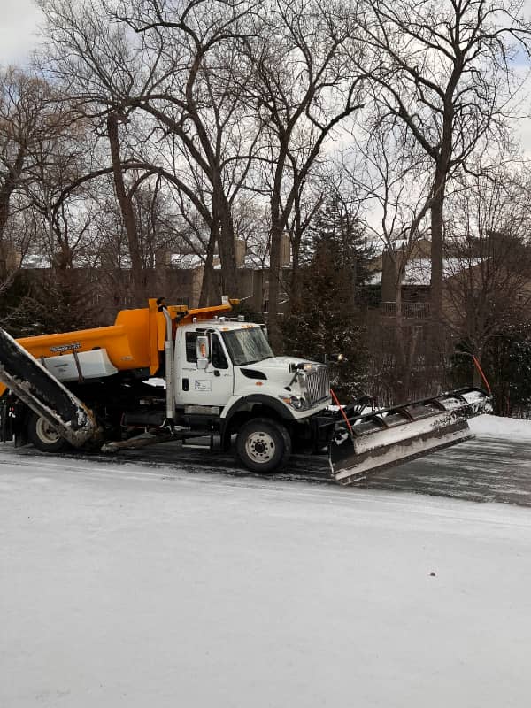 Commercial plow and salter truck staged for a Dane County snow route.