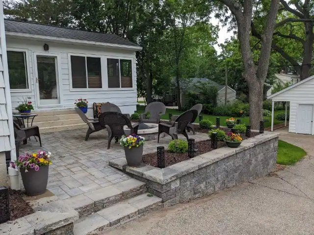 Beautiful outdoor living space featuring durable stonework and lush landscaping.